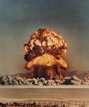(NULCEAR EXPLOSION) A group of 4 large color photographs depicting various American atomic bomb tests in the 1950s, three at the Nevada